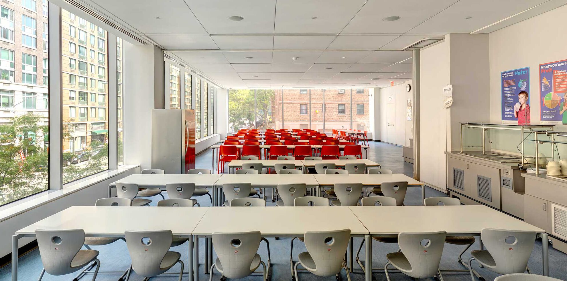 Tables and chairs in a light filled dining room